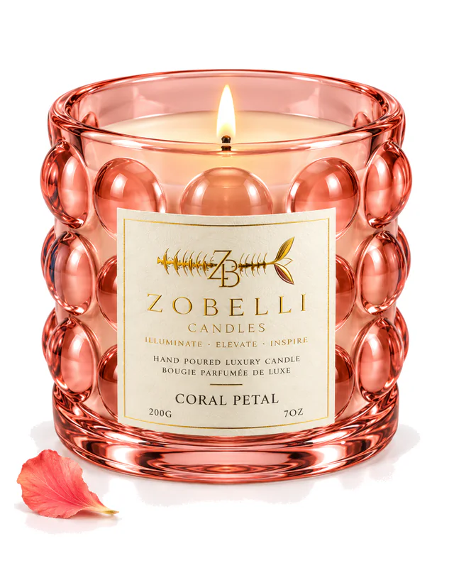 Coral Petal Zobelli candle in coral bubble glass with a printed gold paper label on a white studio background
