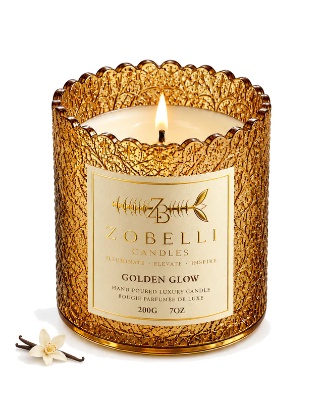 Golden Glow luxury Zobelli candle on a pure white studio background with its printed paper label attached