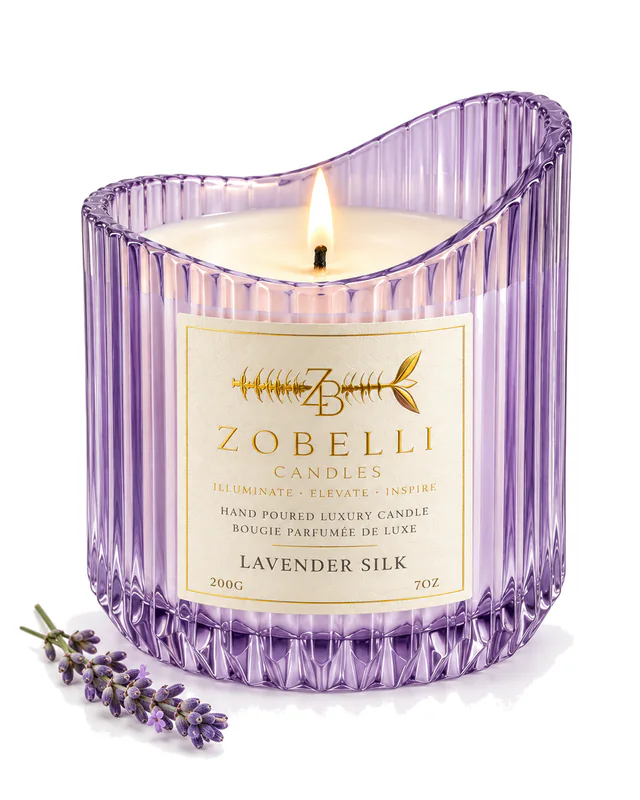 Lavender Silk Zobelli candle in lilac wave-cut glass with a printed gold paper label on a white studio background