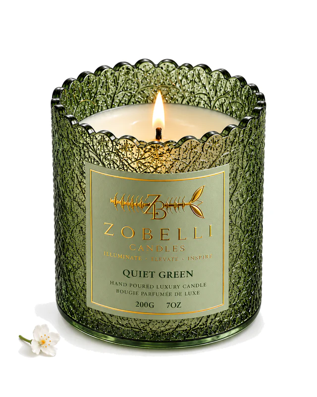 Quiet Green luxury Zobelli candle on a pure white studio background with its printed gold paper label attached to the vessel